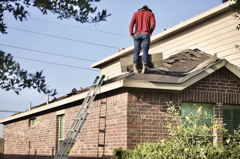 Professional roofer working on a residential roof in Vernon Hills Country Club Estates West
